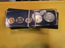 Thirteen mixed Special Mint silver Sets