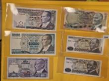 Twelve mixed Middle Eastern pieces of Currency