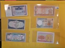 Twenty-five mixed pieces of World Currency