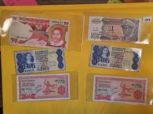 Twenty-one mixed pieces of World Currency