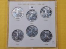 Six GEM Brilliant Uncirculated American Silver Eagles in Capitol Plastic US Silver Eagle Year Set