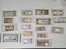 Eighteen mixed pieces of world currency
