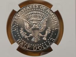 Two NGC Graded Kennedy Clad Half Dollars