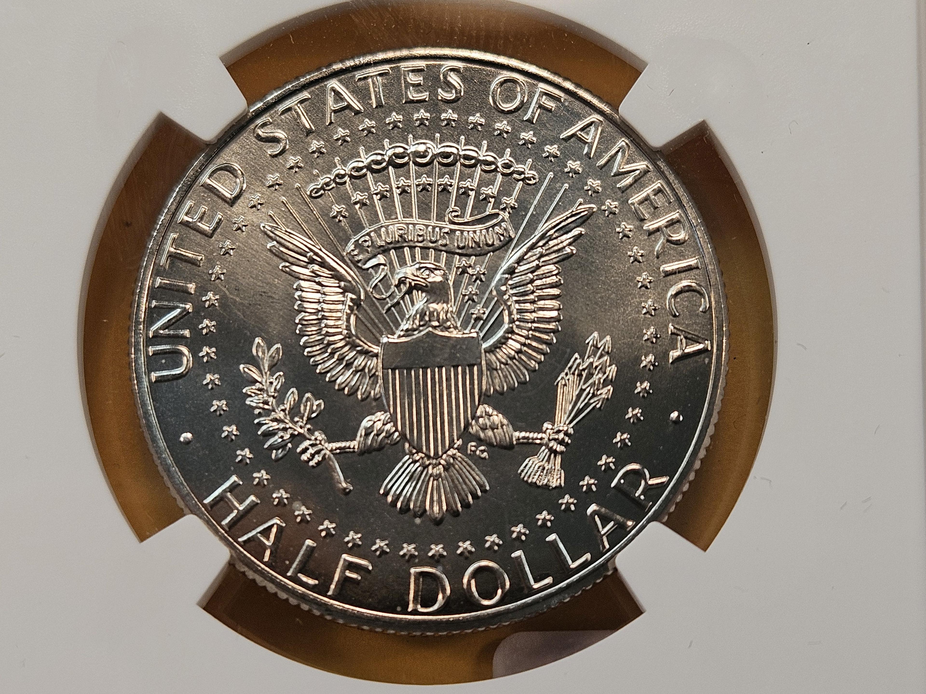 Two NGC Graded Kennedy Clad Half Dollars