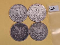 Four mixed Morgan Silver Dollars