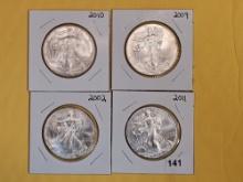 Four GEM Brilliant Uncirculated American Silver Eagles