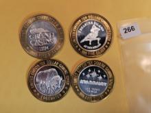 Four Silver center Ten Dollar Casino Gaming Tokens