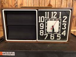 Neon clock with rotating panels