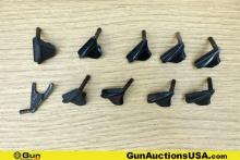 1911 Gun Parts. Good Condition. Ten Assorted 1911 Thumb Safeties.. (76665) (GSCM65)