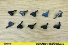 1911 Gun Parts. Good Condition. Ten Assorted 1911 Thumb Safeties.. (76663) (GSCM22)