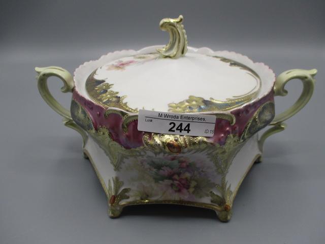 RS Prussia footed cracker jar, satin tiffany trim w. red jewels and poppy d