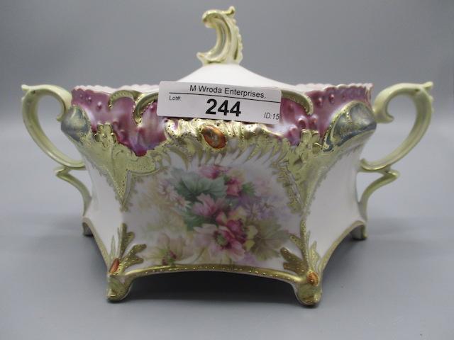 RS Prussia footed cracker jar, satin tiffany trim w. red jewels and poppy d