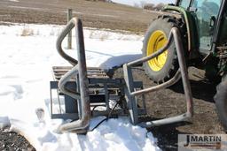Skid mount bale squeezer