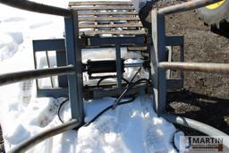 Skid mount bale squeezer