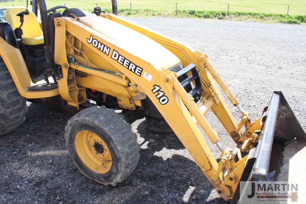 JD 110 loader tractor