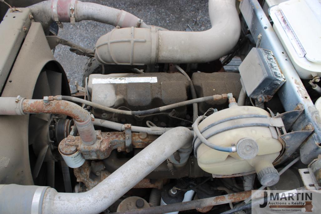 2000 Mack RD6 roll-off truck