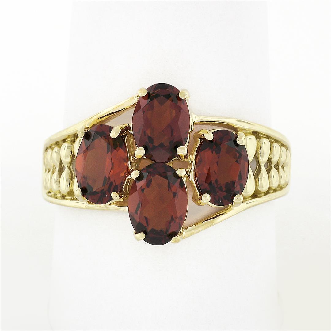 10k Yellow Gold 3.50 ctw Prong Set Oval Cut Garnet Open Work Sides Wide Band Rin