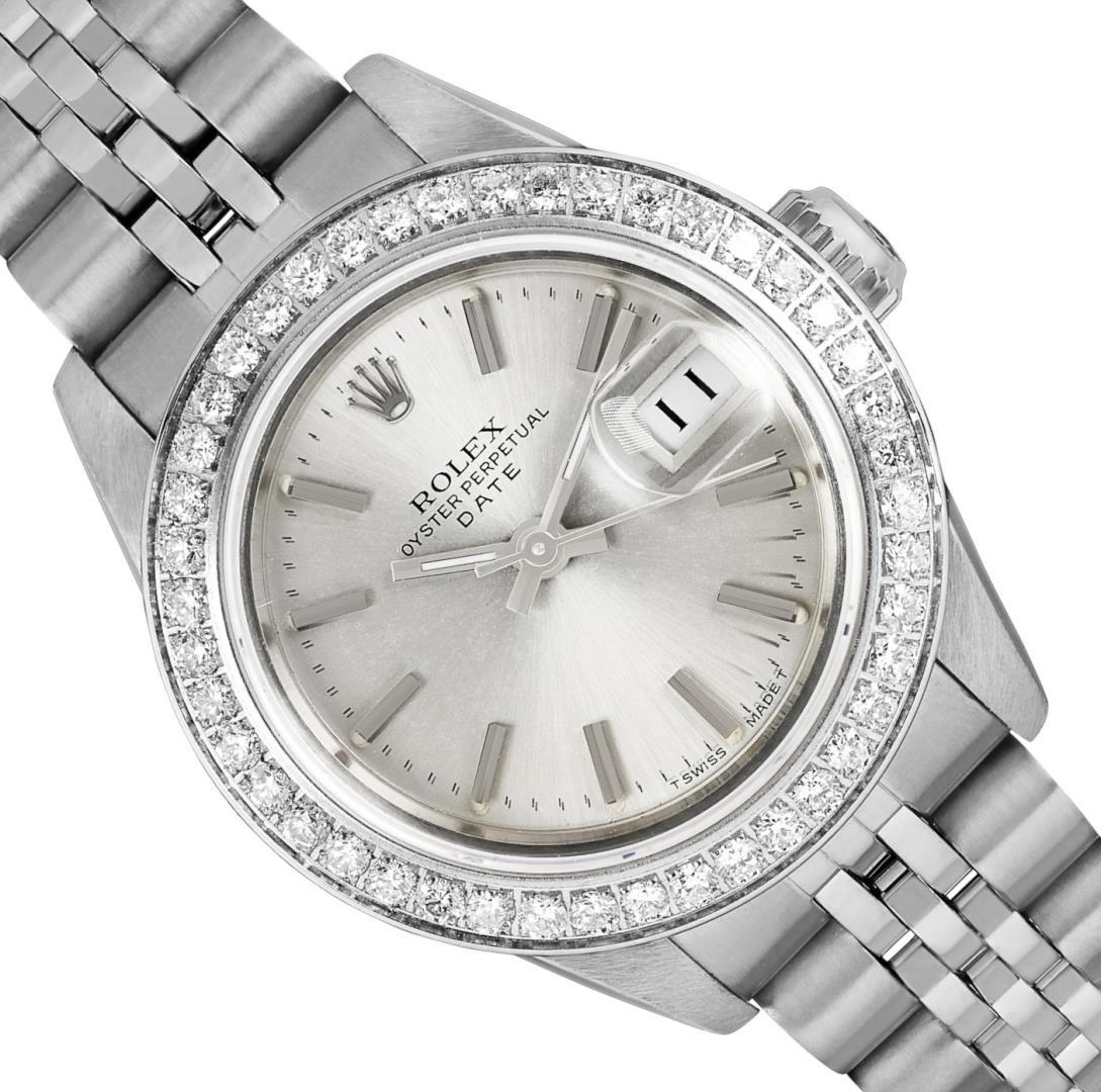 Rolex Ladies Stainless Steel Quickset Silver Index Diamond Bezel Date Watch With