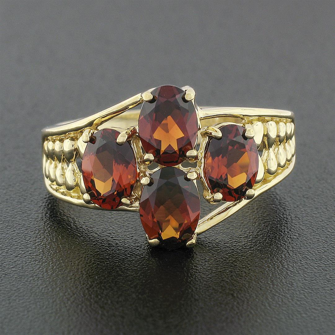 10k Yellow Gold 3.50 ctw Prong Set Oval Cut Garnet Open Work Sides Wide Band Rin