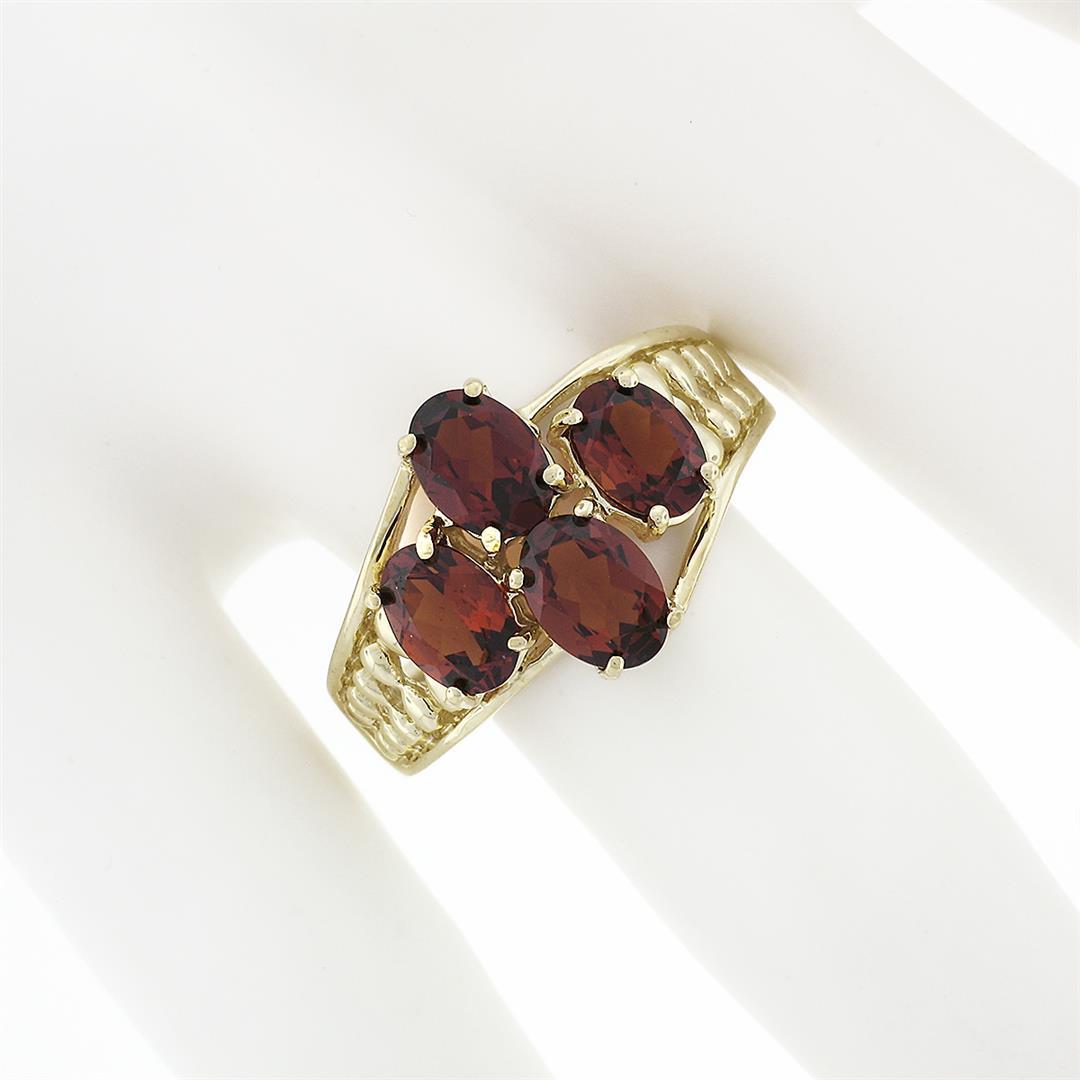 10k Yellow Gold 3.50 ctw Prong Set Oval Cut Garnet Open Work Sides Wide Band Rin