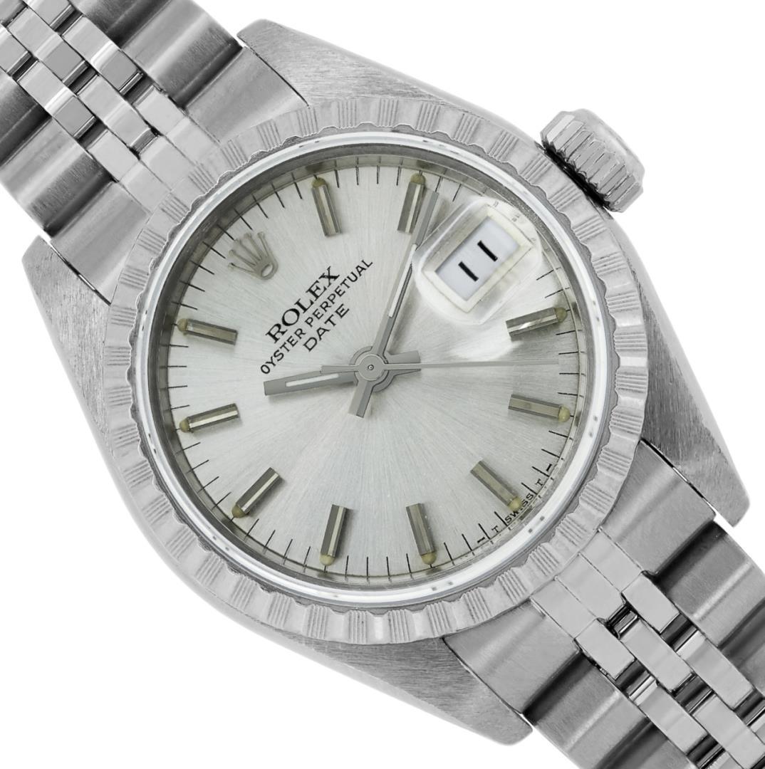 Rolex Ladies Stainless Steel Silver Index Engine Turn Bezel Date Wristwatch With