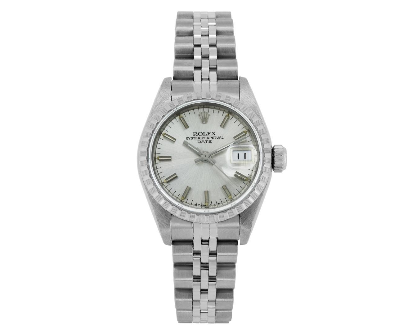 Rolex Ladies Stainless Steel Silver Index Engine Turn Bezel Date Wristwatch With