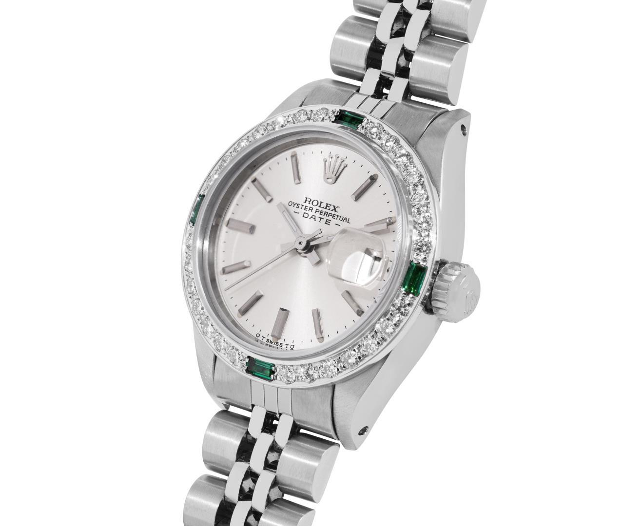 Rolex Ladies Stainless Steel Silver Index Diamond And Emerald Date Watch