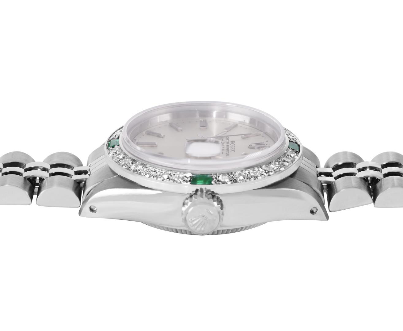 Rolex Ladies Stainless Steel Silver Index Diamond And Emerald Date Watch