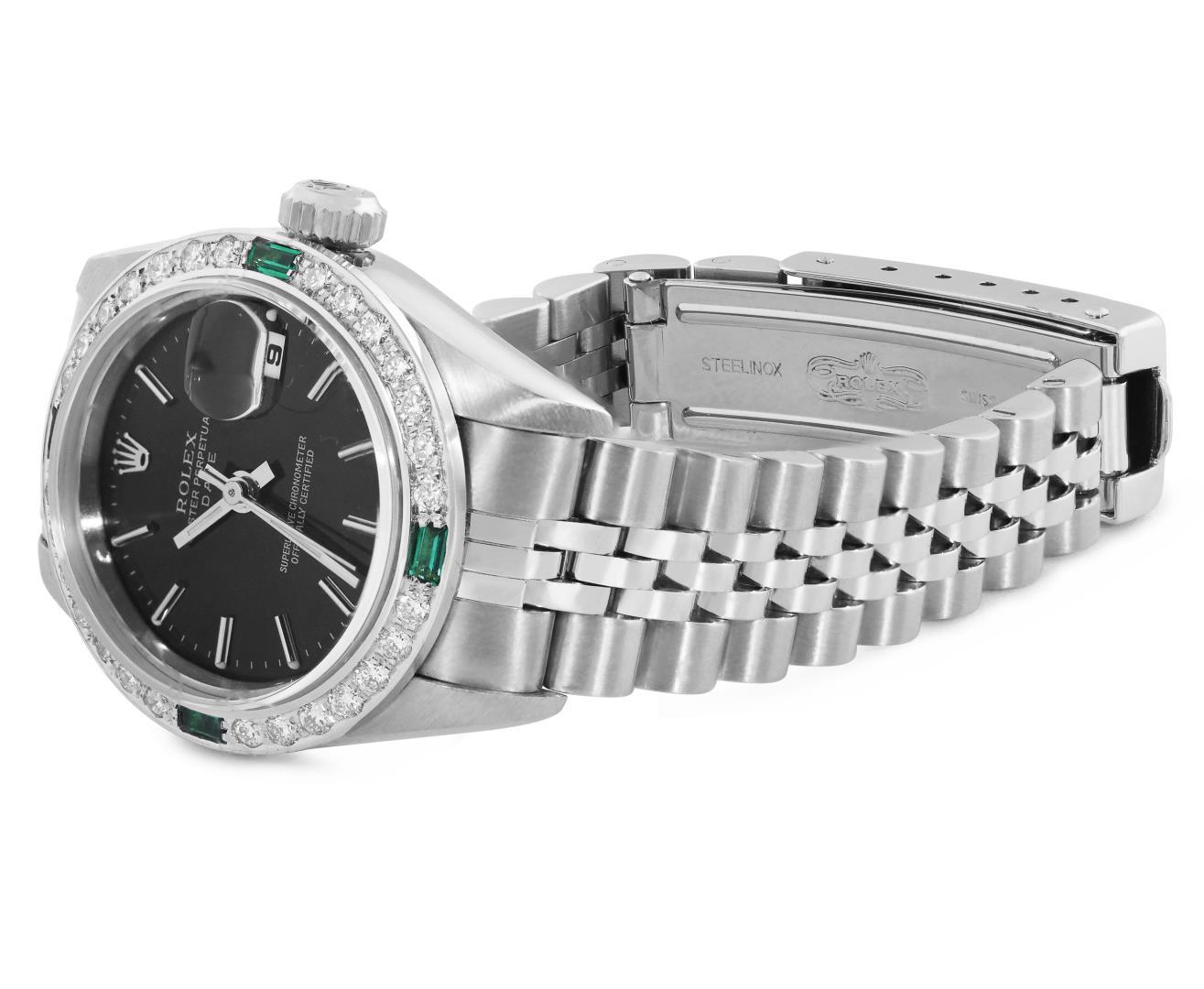 Rolex Ladies Stainless Steel Black Index Dial Diamond And Emerald Bezel Date Wri