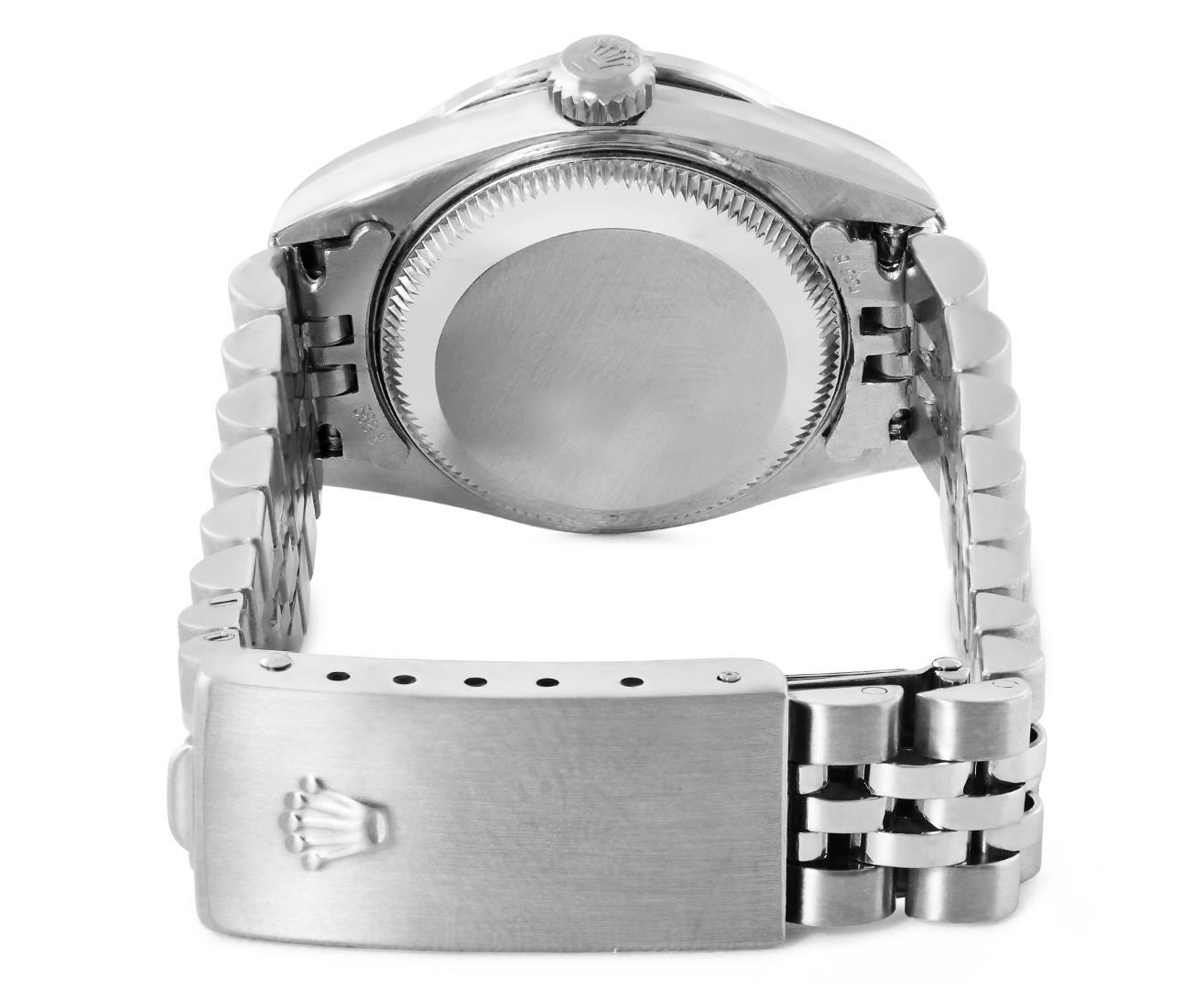Rolex Ladies Stainless Steel Black Index Dial Diamond And Emerald Bezel Date Wri