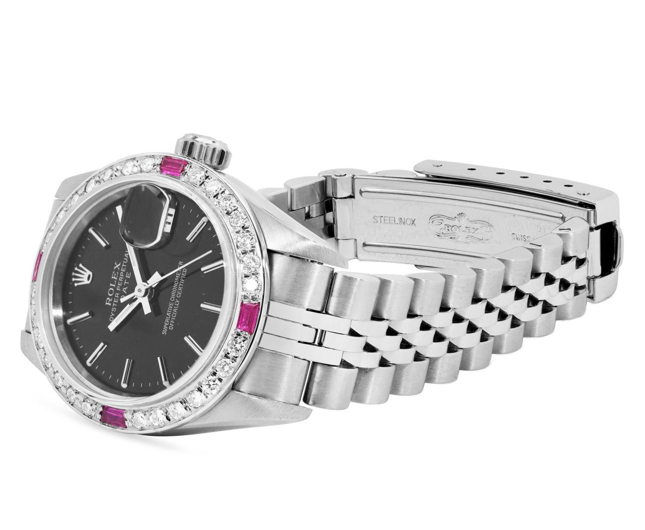 Rolex Ladies Stainless Steel Black Index Dial Diamond And Ruby Bezel Date Wristw