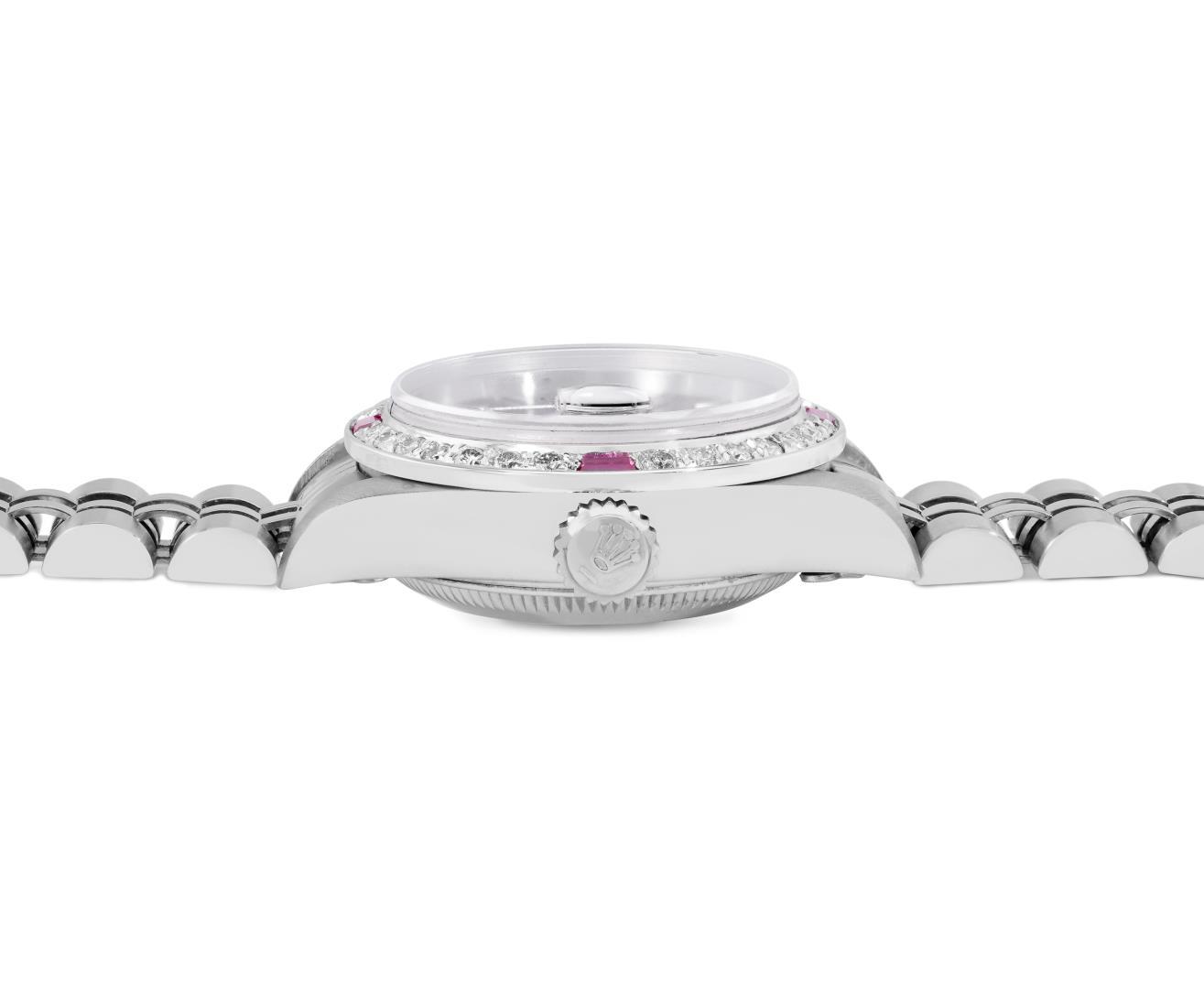 Rolex Ladies Stainless Steel Black Index Dial Diamond And Ruby Bezel Date Wristw