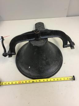 Vintage cast iron bell with clapper and bracket