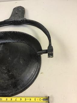 Vintage cast iron bell with clapper and bracket