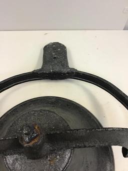 Vintage cast iron bell with clapper and bracket