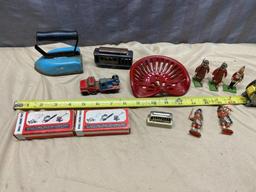 Assorted Toy Soldiers, Small Toy Tractor seat, Vintage Child's Iron, and 2 small engine parts kits