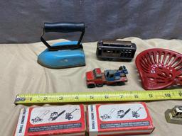 Assorted Toy Soldiers, Small Toy Tractor seat, Vintage Child's Iron, and 2 small engine parts kits