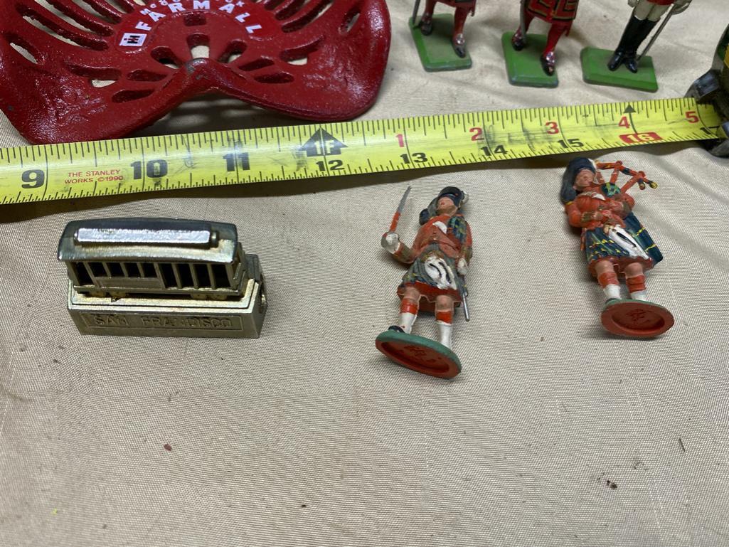 Assorted Toy Soldiers, Small Toy Tractor seat, Vintage Child's Iron, and 2 small engine parts kits