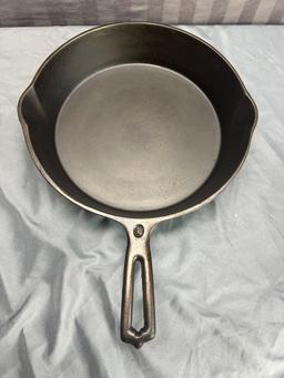 Wapak Indianhead no. 8 Cast Iron Skillet w/ mold mark (imperfection) on bottom, sits flat