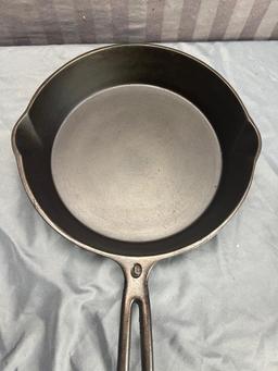 Wapak Indianhead no. 8 Cast Iron Skillet w/ mold mark (imperfection) on bottom, sits flat