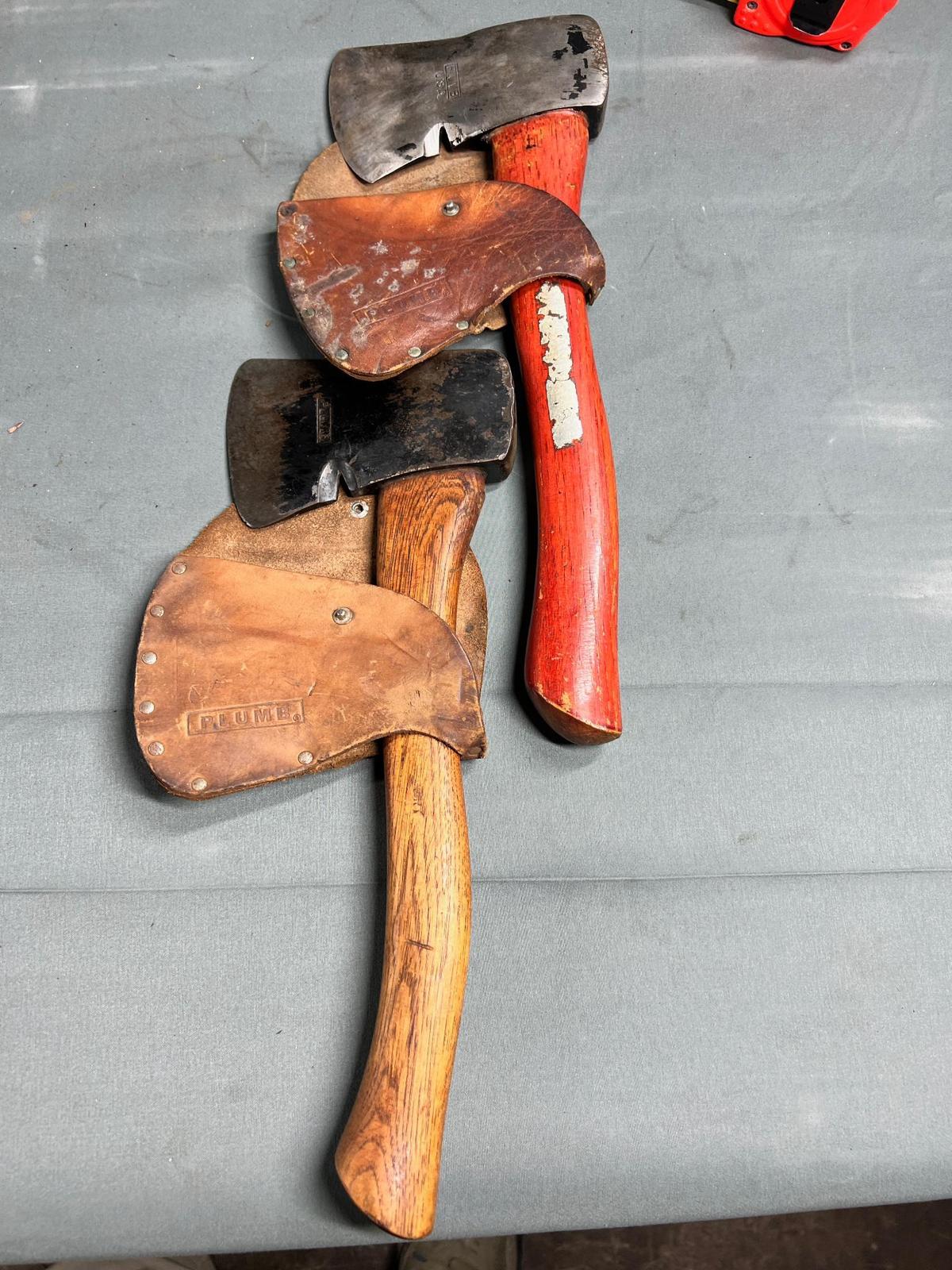2- Plumb Hatchets, both with leather covers, handles appear original