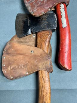 2- Plumb Hatchets, both with leather covers, handles appear original