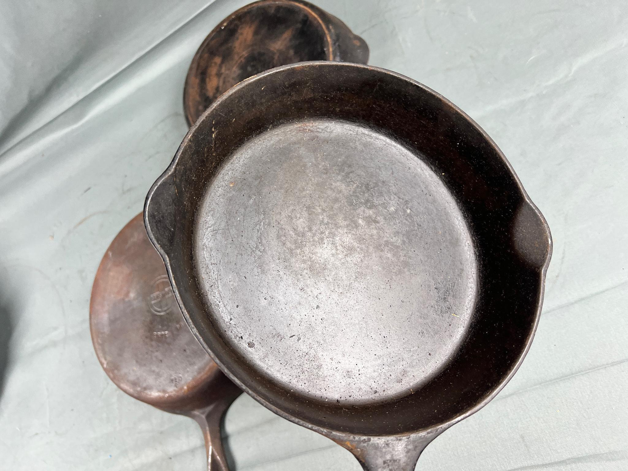 3- Griswold Cast Iron Skillets, No. 7 and 9 Small Block, and Slant no. 8 (slight wobble to no. 8)
