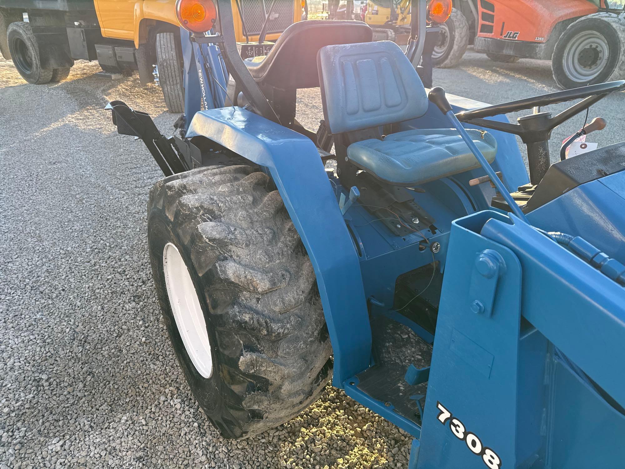 New Holland TC30 Tractor, bucket & backhoe 2278 hrs., SN 324596 on bucket