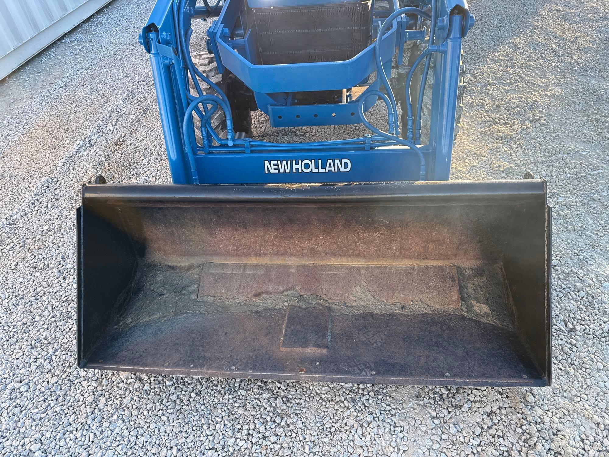 New Holland TC30 Tractor, bucket & backhoe 2278 hrs., SN 324596 on bucket