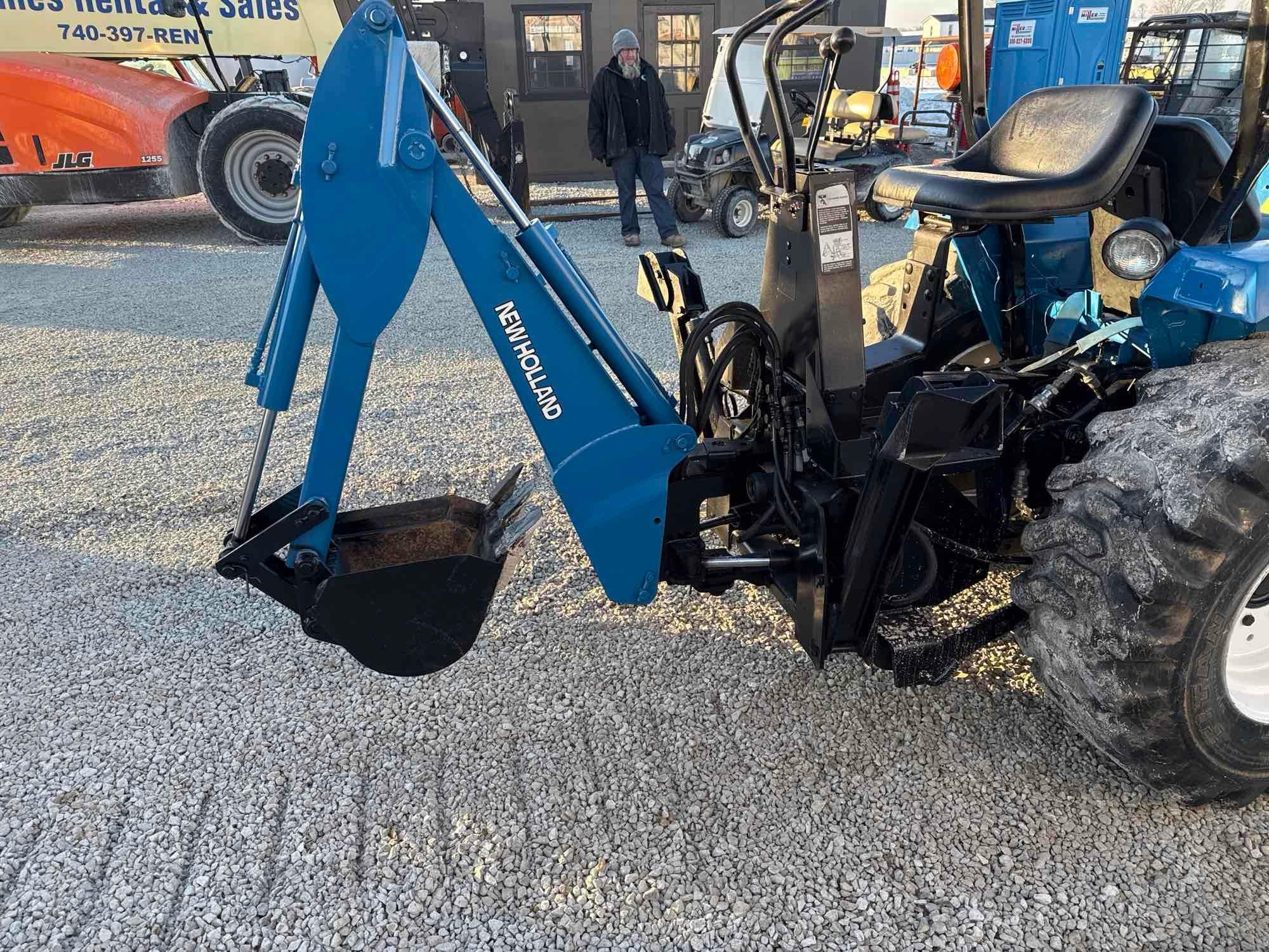 New Holland TC30 Tractor, bucket & backhoe 2278 hrs., SN 324596 on bucket