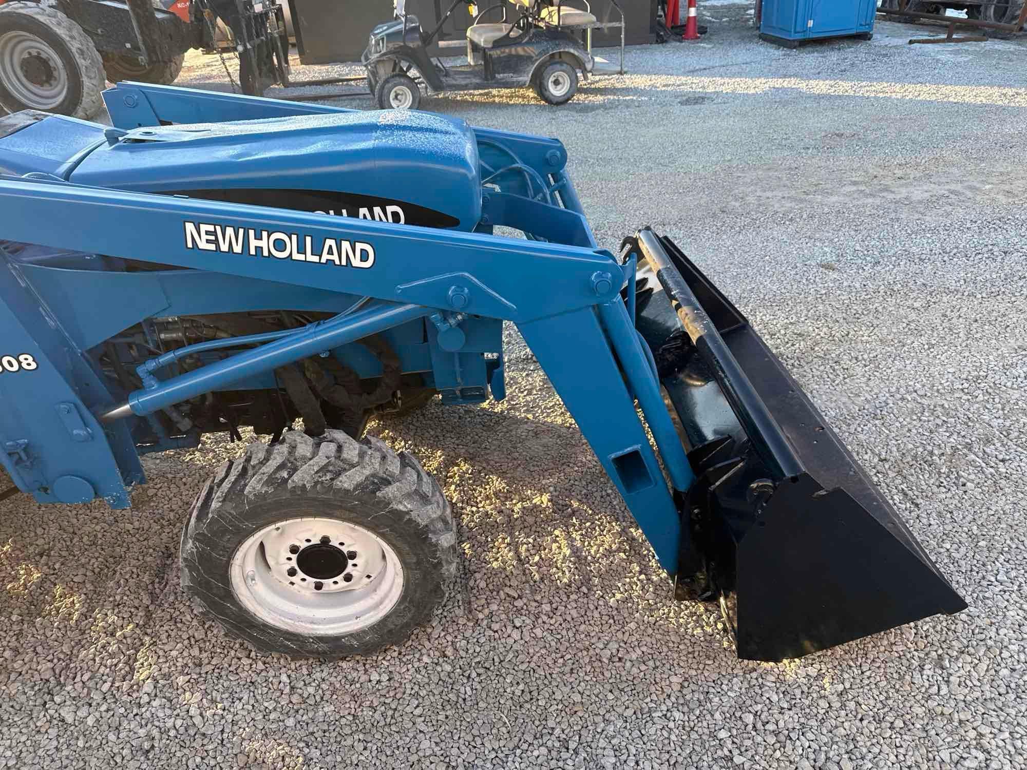 New Holland TC30 Tractor, bucket & backhoe 2278 hrs., SN 324596 on bucket