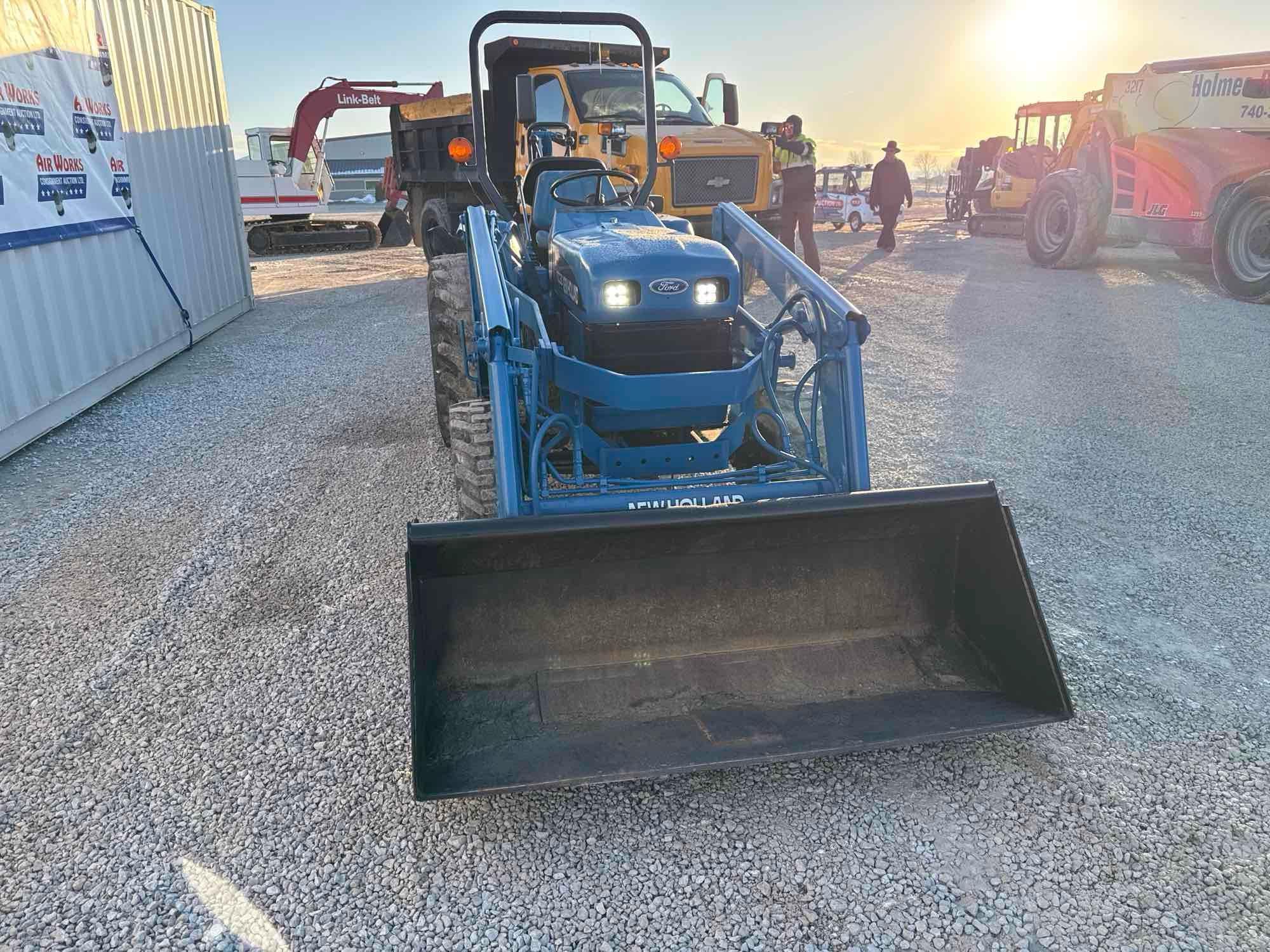 New Holland TC30 Tractor, bucket & backhoe 2278 hrs., SN 324596 on bucket
