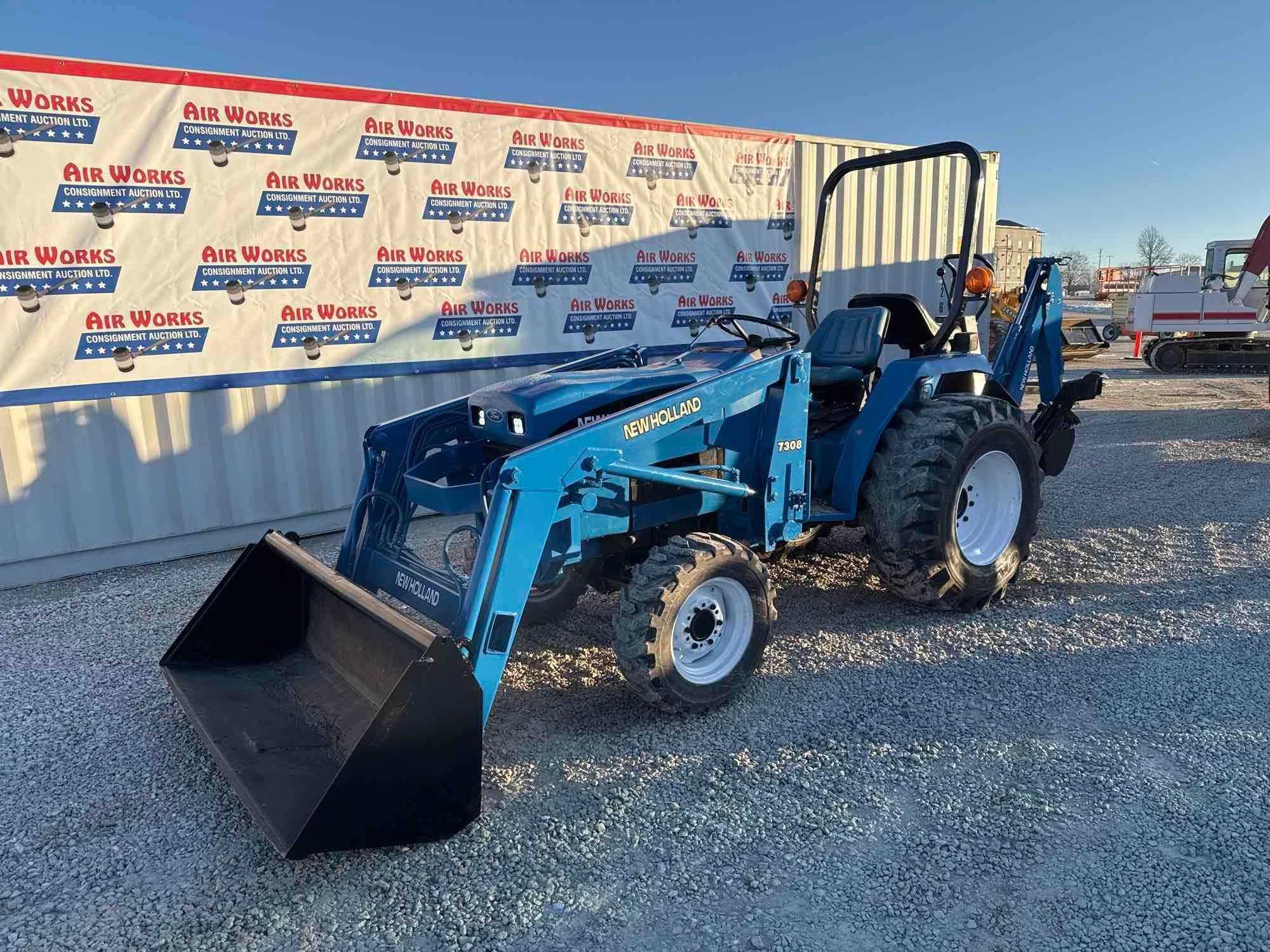 New Holland TC30 Tractor, bucket & backhoe 2278 hrs., SN 324596 on bucket