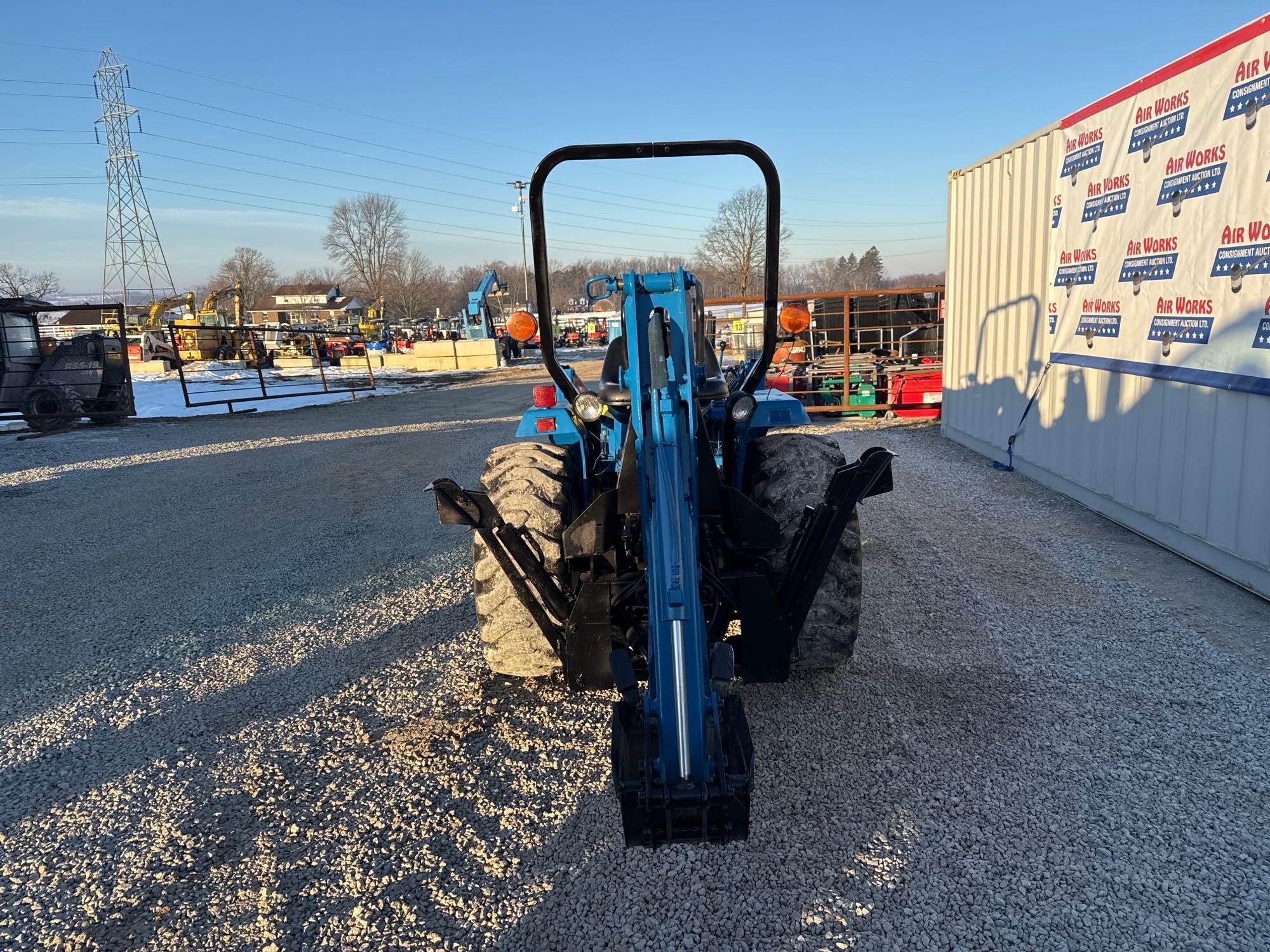 New Holland TC30 Tractor, bucket & backhoe 2278 hrs., SN 324596 on bucket